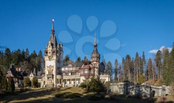 Peleș Castle near Sinaia and the Carpathian Mountains in a sunny day. Transylvania, Romania