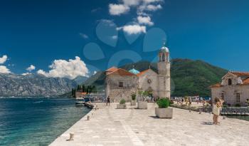 Perast, Montenegro - 07.11.2018.  Our Lady of the Rocks church on an Island in the Bay of Kotor, Montenegro,  in a sunny summer day