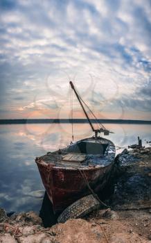 Old boat of the mud getters on the salt lake Kuyalnik in Odessa, Ukraine