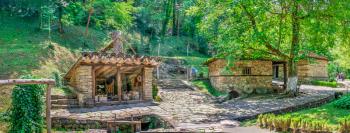 Old traditional house in the Etar Architectural Ethnographic Complex in Bulgaria on a sunny summer day. Big size panoramic photo.