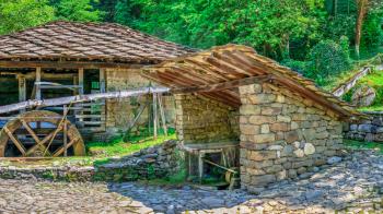 Gabrovo, Etar, Bulgaria - 07.27.2019. Water mill in the Etar Architectural Ethnographic Complex in Bulgaria on a sunny summer day. Big size panoramic photo.