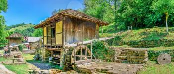 Gabrovo, Etar, Bulgaria - 07.27.2019. Water mill in the Etar Architectural Ethnographic Complex in Bulgaria on a sunny summer day. Big size panoramic photo.