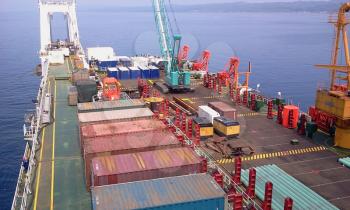 The cargo ship with the crane, the top view. Pipelaying barge.