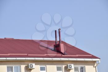 The roof of corrugated sheet. Roofing of metal profile wavy shape.