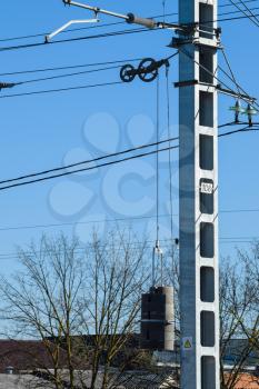 pillar of power line. Counterweight for tensioning wires