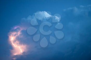 Lightnings in storm clouds. Peals of a thunder and the sparkling lightnings in clouds.