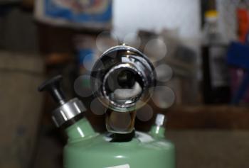 Blowtorch, general view. Blowtorch with a green tank
