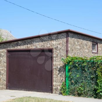 Car garage of corrugated metal a profile