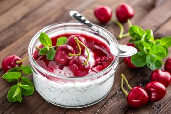 Fresh yogurt with cherry and chia seeds, delicious dessert for healthy breakfast