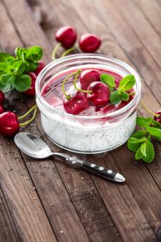 Fresh yogurt with cherry and chia seeds, delicious dessert for healthy breakfast