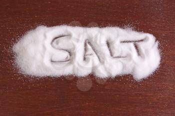 sprinkled salt on white wooden table