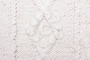 White blue knitted texture with pattern. Wool jersey background