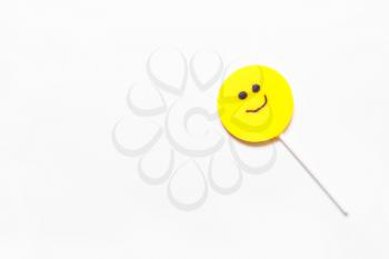 Lollipop, candy smile on a white background. Top view, flat