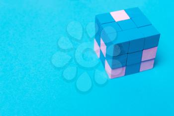 Geometric cube of blue, male and pink female parts. The concept of equality, sexism, feminism