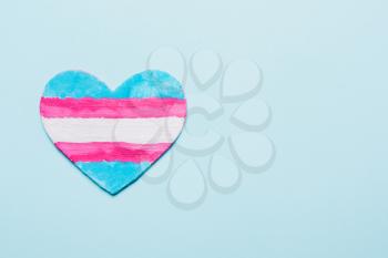 Heart color flag transgender . Pink, white, blue background.