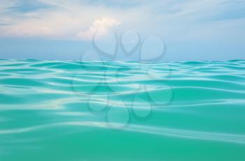 Sea wave close up, low angle view water and sky background.