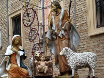 details of architecture, historical buildings of Italy. Stone walls and stone mask. Loreto. Christmas Nativity scene