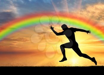 Runner, rainbow, sport. Male runner at sunset and rainbow background