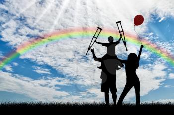 Happy family and disabled child with crutches sits on shoulders balloon and rainbow day. Concept happy disabled and family