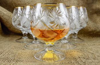 Aged whiskey in a crystal glass. design element