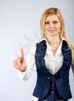 Concept of attention. Business woman showing a finger gesture attention