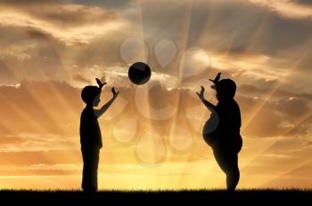 Fat boy and a normal boy playing ball at sunset. concept of childhood obesity