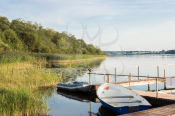 Boats on the shore of Lake Perhovo, Tver region, Russia.