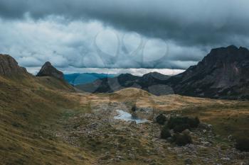 Montenegro, national park Durmitor, mountains and clouds. National mountains park Durmitor in Montenegro - nature travel background