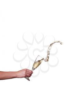 champagne splash from glass with female hand isolated on the white background