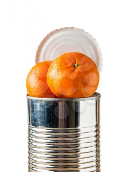 Orange, tangerine or satsuma fruit heaped inside opened tin can container in concept of fresh food coming in cans