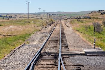 Railway track of Taieri Gorge tourist railway on straight run on its journey up the valley