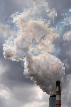 Smoke and yellow fumes billow fron chimney of coal powered power station in West Virginia