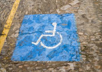 Hand painted disabled driver parking sign in Arcos de la Frontera near Cadiz in Spain
