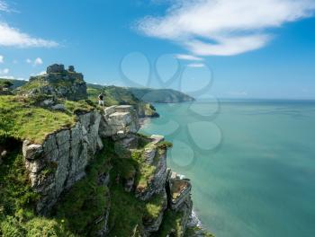 Hiker on the headland in Valley of the Rocks on South West coast path near Lynmouth
