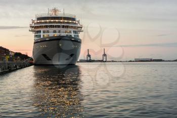 Bow of a large cruise ship at dusk moored in Copenhagen harbor in Denmark