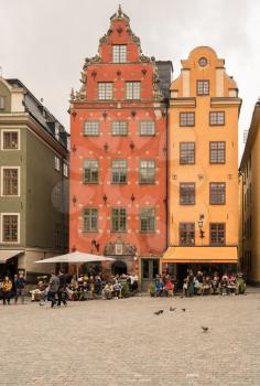 STOCKHOLM, SWEDEN - SEPTEMBER 9: Tourists in Stortorget square in Gamla Stan on September 9, 2017 in Stockholm, Sweden. The Nobel Museum is in this square.