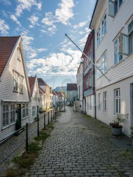 Narrow cobbestone Ytre Markeveien Street in the old town of Bergen in Norway