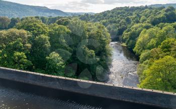 View of River Dee from top of old Pontcysyllte Aqueduct near Chirk carrying Llangollen Canal across river Dee