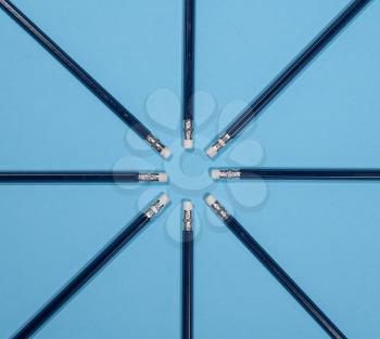 Set of new blue pencils with erasers in form of a star or protractor to illustrate angles and geometry for back to school message