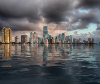 Miami cityscape skyline at sunrise on cloudy morning with an artificial sea illustrating flooding concept