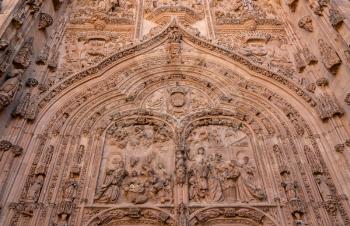 Ornate bible carvings in the facade and entrance to the old Cathedral in Salamanca