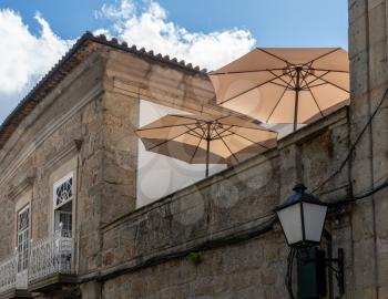 Umbrellas on rooftop restaurant in the old town of Guimaraes