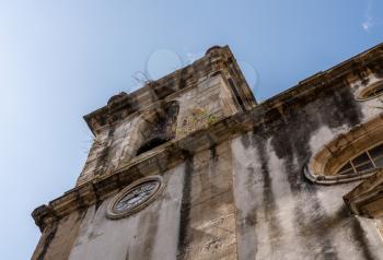 Old church tower of Sao Bartholomeu church in downtown Coimbra in Portugal
