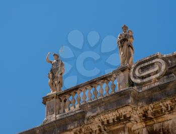 Statues above the entrance to cathedral church in the old town of Dubrovnik in Croatia