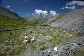 Mountain landscape. Highlands, the mountain peaks, gorges and valleys. The stones on the slopes.