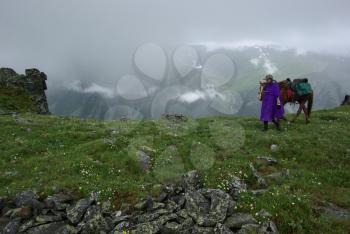 Mountain landscape. Highlands, the mountain peaks, gorges and valleys. The stones on the slopes.