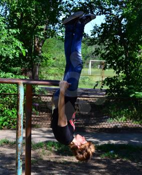 Yard gymnastics. Classes are on the horizontal bar and parallel bars.