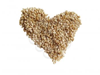 Sesame seeds in the form of heart on a white background