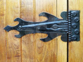 Very old ironwork hinges at wooden blinds