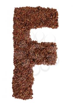 Letter F made with Linseed also known as flaxseed isolated on white background. Clipping Path included